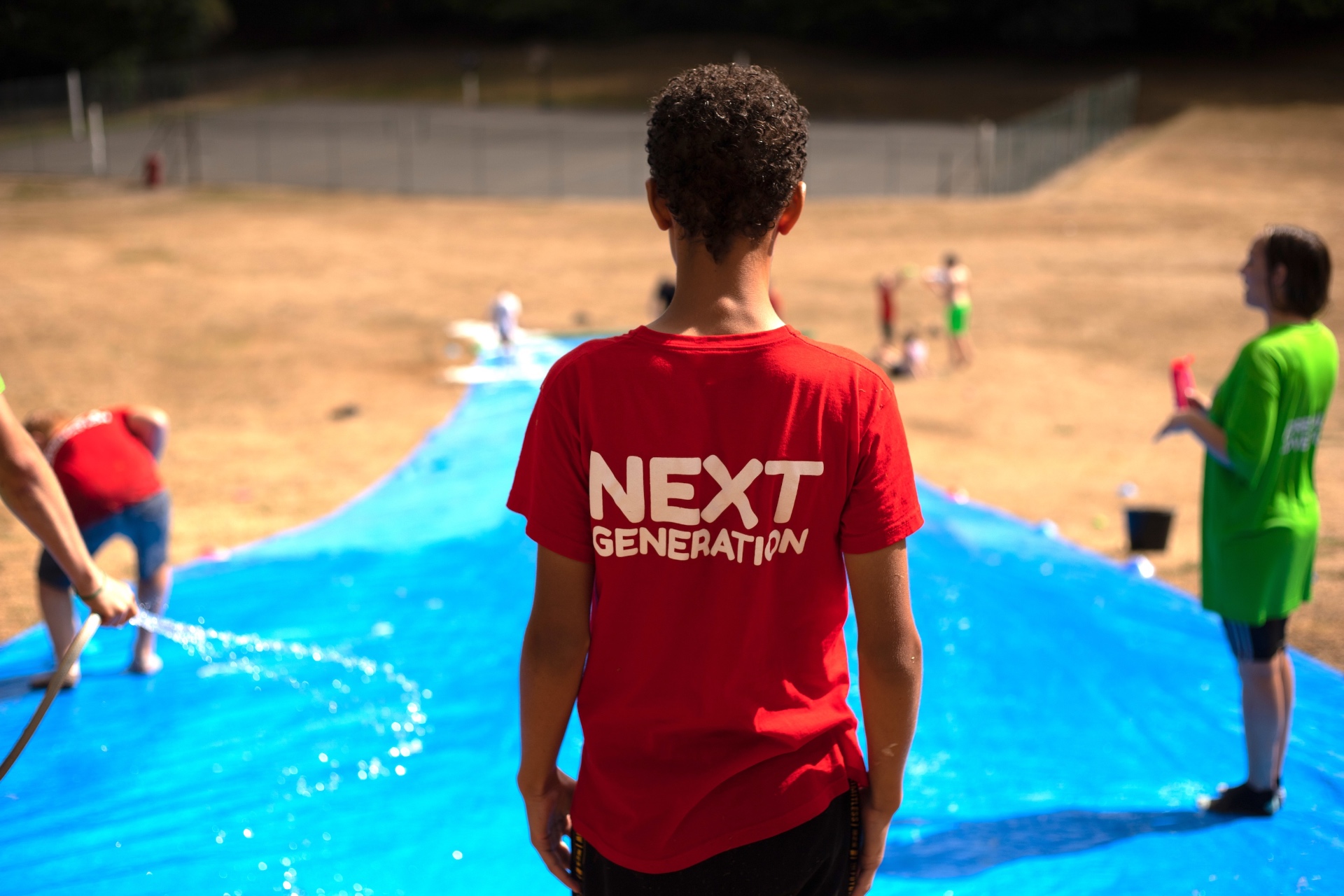 Next Generation leader in red uniform