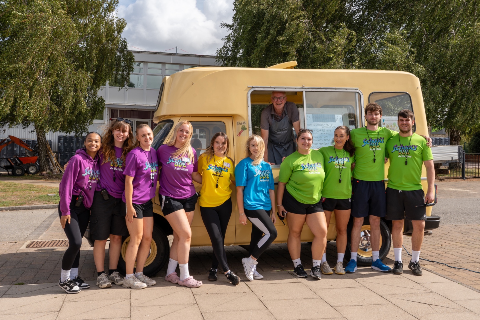 Team group photo by ice cream van